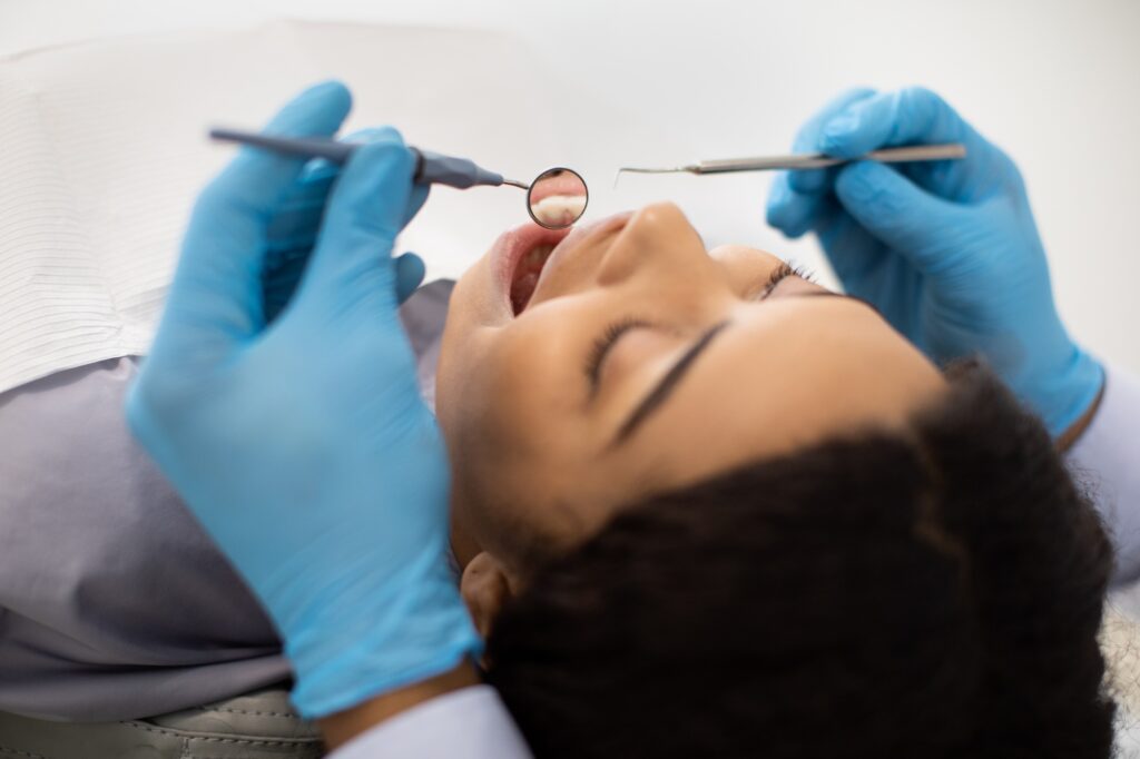Dentist performing a dental cleaning in Statesville, NC